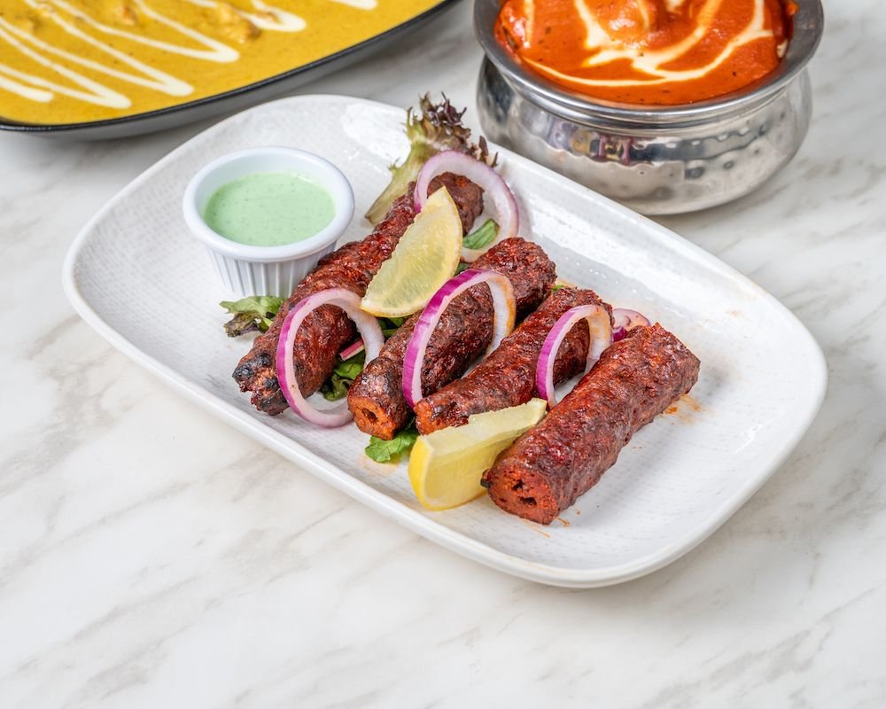 Seekh kebabs with onion and lemon